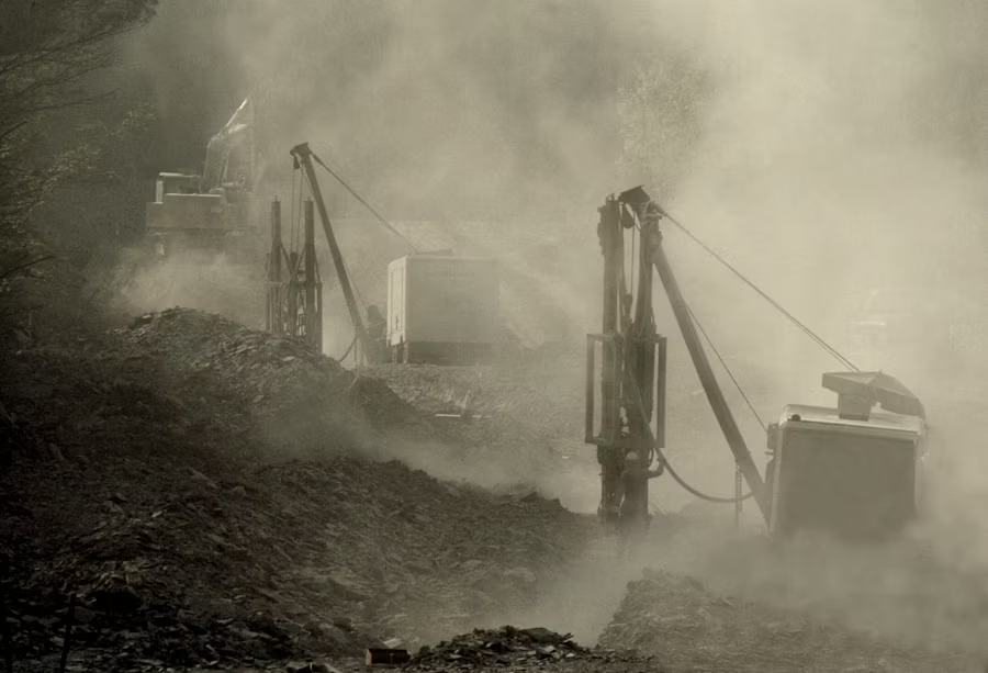 Open pit mining operations with heavy machinery in Tanzania